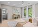 Open-concept main bedroom with access to an ensuite bathroom and large windows at 624 Heather Ln, Charlotte, NC 28209