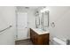 Bathroom with double sink vanity and modern fixtures, ample counter space and wood floors at 6430 Matlea Ct, Charlotte, NC 28215