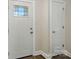 Bright entryway featuring wood-look flooring and a white door with decorative glass at 6430 Matlea Ct, Charlotte, NC 28215