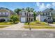 Charming two-story home featuring neutral siding, red shutters, a manicured lawn, and attached single-car garage at 6430 Matlea Ct, Charlotte, NC 28215
