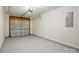 A well-lit two-car garage boasts epoxy flooring and overhead storage at 6430 Matlea Ct, Charlotte, NC 28215