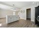 Bright kitchen with an island, gray cabinets and stainless steel appliances at 6430 Matlea Ct, Charlotte, NC 28215