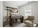 This office has a modern look with built in shelves for extra storage and lots of natural light at 6430 Matlea Ct, Charlotte, NC 28215