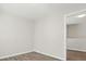 An empty room with fresh paint and luxury vinyl plank flooring at 6430 Matlea Ct, Charlotte, NC 28215