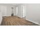 A bright room showcases new paint, luxury vinyl plank flooring, and doorways at 6430 Matlea Ct, Charlotte, NC 28215