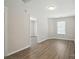 This is a bright room shows new paint, luxury vinyl plank flooring, and a window at 6430 Matlea Ct, Charlotte, NC 28215
