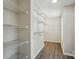 Spacious walk-in closet with wire shelving providing ample storage solutions at 6430 Matlea Ct, Charlotte, NC 28215