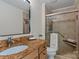 Bathroom featuring decorative vanity, granite countertop, and updated walk in shower at 6719 Woodshed Cir, Charlotte, NC 28270