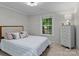 Bedroom with natural light, neutral paint, comfortable decor, and bright window at 6719 Woodshed Cir, Charlotte, NC 28270