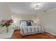 Well lit bedroom with a decorative lighting fixture, fresh flowers, and comfortable decor at 6719 Woodshed Cir, Charlotte, NC 28270
