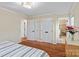 Spacious bedroom with double closets, neutral walls, and en suite bathroom at 6719 Woodshed Cir, Charlotte, NC 28270
