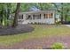 Charming home featuring a welcoming front porch, white facade and landscaped front yard at 6719 Woodshed Cir, Charlotte, NC 28270