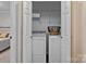 Laundry room with washer, dryer, shelving, and closet space for storage at 6719 Woodshed Cir, Charlotte, NC 28270