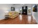 Bright living room with a modern fireplace, hardwood floors, and a comfortable sofa at 6719 Woodshed Cir, Charlotte, NC 28270