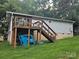 Exterior shot of a wooden back deck with outdoor furniture and wood supports at 6813 Navajo Trl, Sherrills Ford, NC 28673