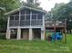 A view of the back of the house with a screened in porch and back deck at 6813 Navajo Trl, Sherrills Ford, NC 28673