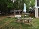 Backyard patio with swing and table seating, perfect for outdoor dining at 6813 Navajo Trl, Sherrills Ford, NC 28673