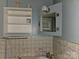 This bathroom features an open medicine cabinet and sink with tile accents at 6813 Navajo Trl, Sherrills Ford, NC 28673