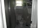 Bathroom with ceramic tile flooring, toilet, and a shower stall at 6813 Navajo Trl, Sherrills Ford, NC 28673