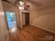 Bedroom with wood-look flooring, neutral walls, and an open closet provides a versatile space at 6813 Navajo Trl, Sherrills Ford, NC 28673
