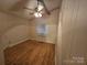 This cozy bedroom features wood-look flooring, neutral walls, and bright overhead lighting at 6813 Navajo Trl, Sherrills Ford, NC 28673