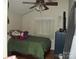Cozy bedroom features warm wood floors, window, and a ceiling fan at 6813 Navajo Trl, Sherrills Ford, NC 28673