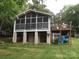 Exterior view showing the screened-in porch and the wooden deck, enhancing outdoor living at 6813 Navajo Trl, Sherrills Ford, NC 28673