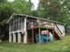 Side exterior showing deck with table and chairs, plus screened in porch at 6813 Navajo Trl, Sherrills Ford, NC 28673