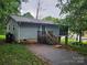 Exterior of the home with light blue siding, a small porch, and a lush green yard at 6813 Navajo Trl, Sherrills Ford, NC 28673
