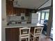 Cozy kitchen with essential appliances and barstool seating at 6813 Navajo Trl, Sherrills Ford, NC 28673
