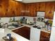 Efficient kitchen with ample cabinet space, a white countertop, and standard appliances at 6813 Navajo Trl, Sherrills Ford, NC 28673
