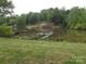 Scenic lake view surrounded by lush green trees, docks and calm waters at 6813 Navajo Trl, Sherrills Ford, NC 28673