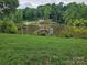 Scenic view of the lake from the property with trees in the background at 6813 Navajo Trl, Sherrills Ford, NC 28673
