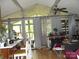 Cozy living room with a view, vaulted ceiling, and lots of natural light from surrounding windows at 6813 Navajo Trl, Sherrills Ford, NC 28673