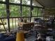 Outdoor screened porch with nature views, offering a relaxing and comfortable seating area at 6813 Navajo Trl, Sherrills Ford, NC 28673