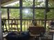 Relaxing screened porch offering beautiful lake views and a peaceful outdoor living space at 6813 Navajo Trl, Sherrills Ford, NC 28673