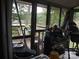 Enclosed porch with serene water views and outdoor seating, a relaxing spot for enjoying nature at 6813 Navajo Trl, Sherrills Ford, NC 28673