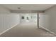 Spacious basement with natural light showcases a versatile area perfect for various activities and storage at 7016 Wannamaker Ln, Charlotte, NC 28226