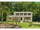 Traditional two-story home with manicured lawn and front yard seating area at 7016 Wannamaker Ln, Charlotte, NC 28226