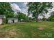 Spacious backyard with a shed, trees, and ample green space at 85 Sw Myrtle Sw Ave, Concord, NC 28025