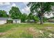 Lush backyard with green grass, trees, and a shed at 85 Sw Myrtle Sw Ave, Concord, NC 28025