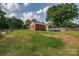 Expansive backyard with lush green grass and a charming brick home at 85 Sw Myrtle Sw Ave, Concord, NC 28025