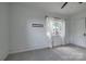 Bright bedroom features a plush gray carpet and natural light from a large window at 85 Sw Myrtle Sw Ave, Concord, NC 28025