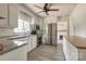 Bright kitchen features stainless steel appliances, white cabinets and grey countertops at 85 Sw Myrtle Sw Ave, Concord, NC 28025