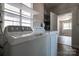 Bright laundry room featuring a washing machine and dryer with plenty of natural light at 85 Sw Myrtle Sw Ave, Concord, NC 28025