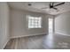 Cozy living room with neutral walls, modern flooring, and a ceiling fan at 85 Sw Myrtle Sw Ave, Concord, NC 28025