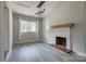 Spacious living room featuring a fireplace and laminate flooring at 85 Sw Myrtle Sw Ave, Concord, NC 28025