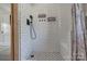 Modern shower with subway tile, sleek black fixtures, and built-in shelving at 85 Sw Myrtle Sw Ave, Concord, NC 28025