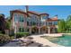 Luxury home featuring an outdoor pool and patio area perfect for entertaining and relaxation at 8904 Woodhall Lake Dr, Waxhaw, NC 28173