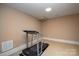 Basement features a treadmill and plenty of space for working out at 8904 Woodhall Lake Dr, Waxhaw, NC 28173
